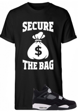 Load image into Gallery viewer, Black t-shirt with &#39;Secure the Bag&#39; graphic and a black sneaker on a white background
